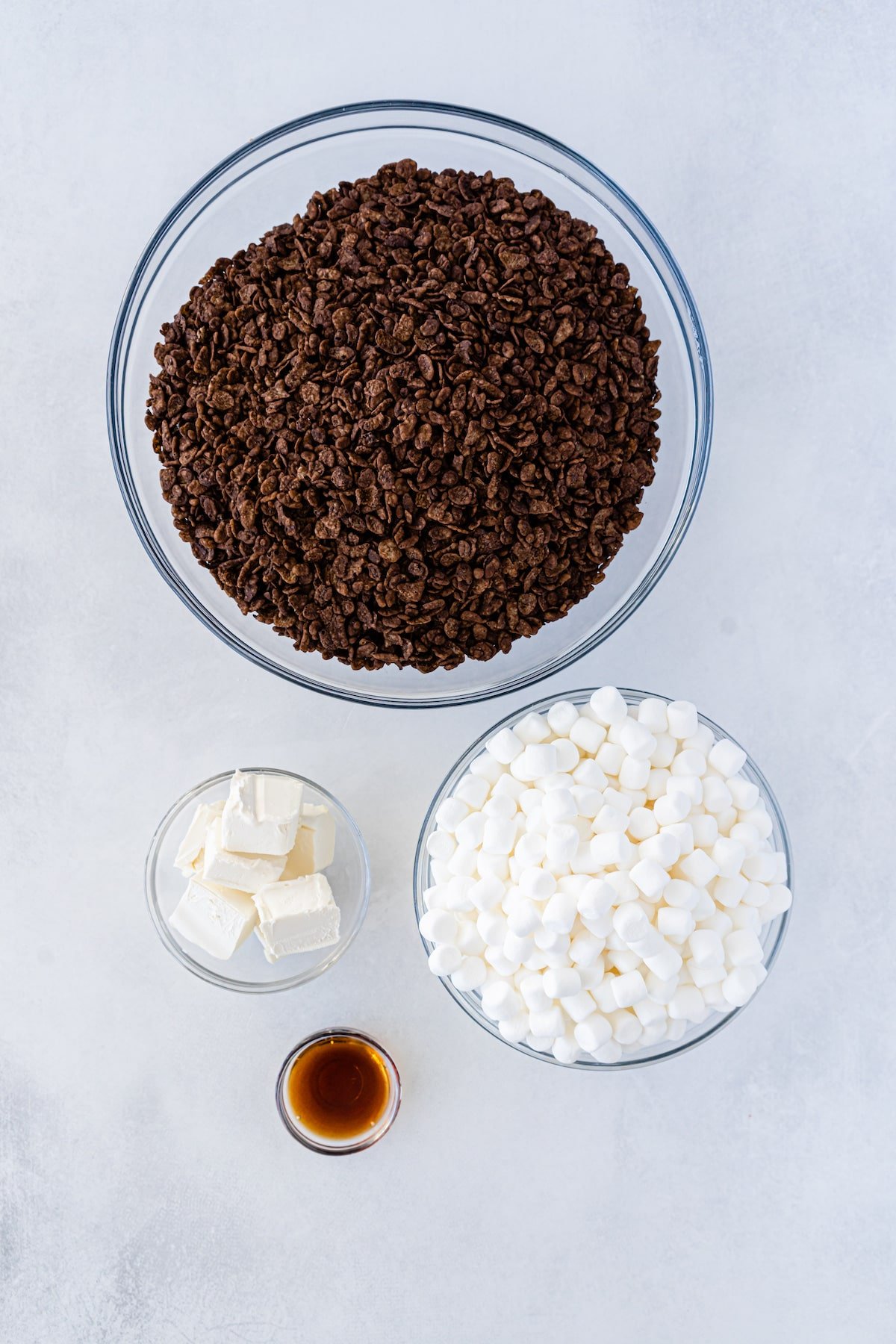Overhead shot of four ingredients needed to make chocolate rice krispie treats