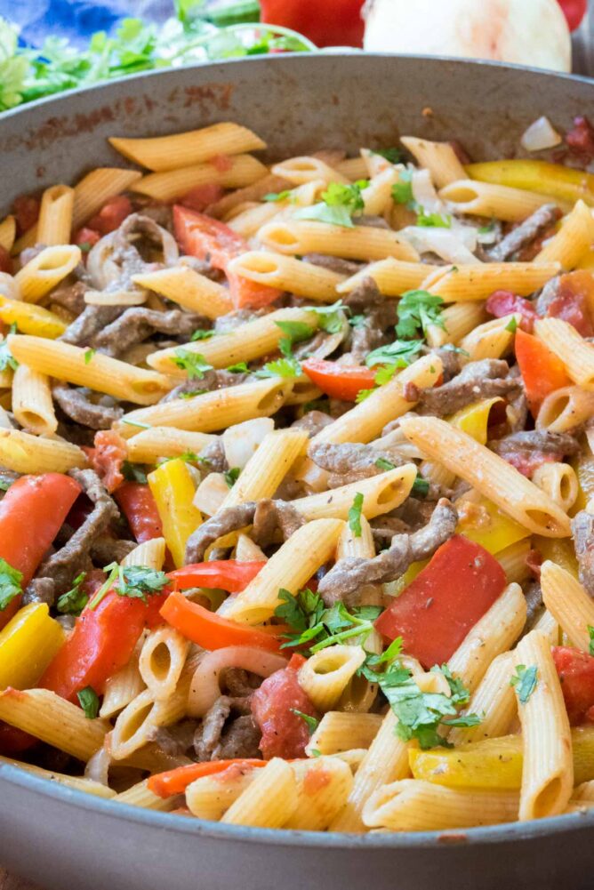 Steak fajita pasta in a deep dish skillet