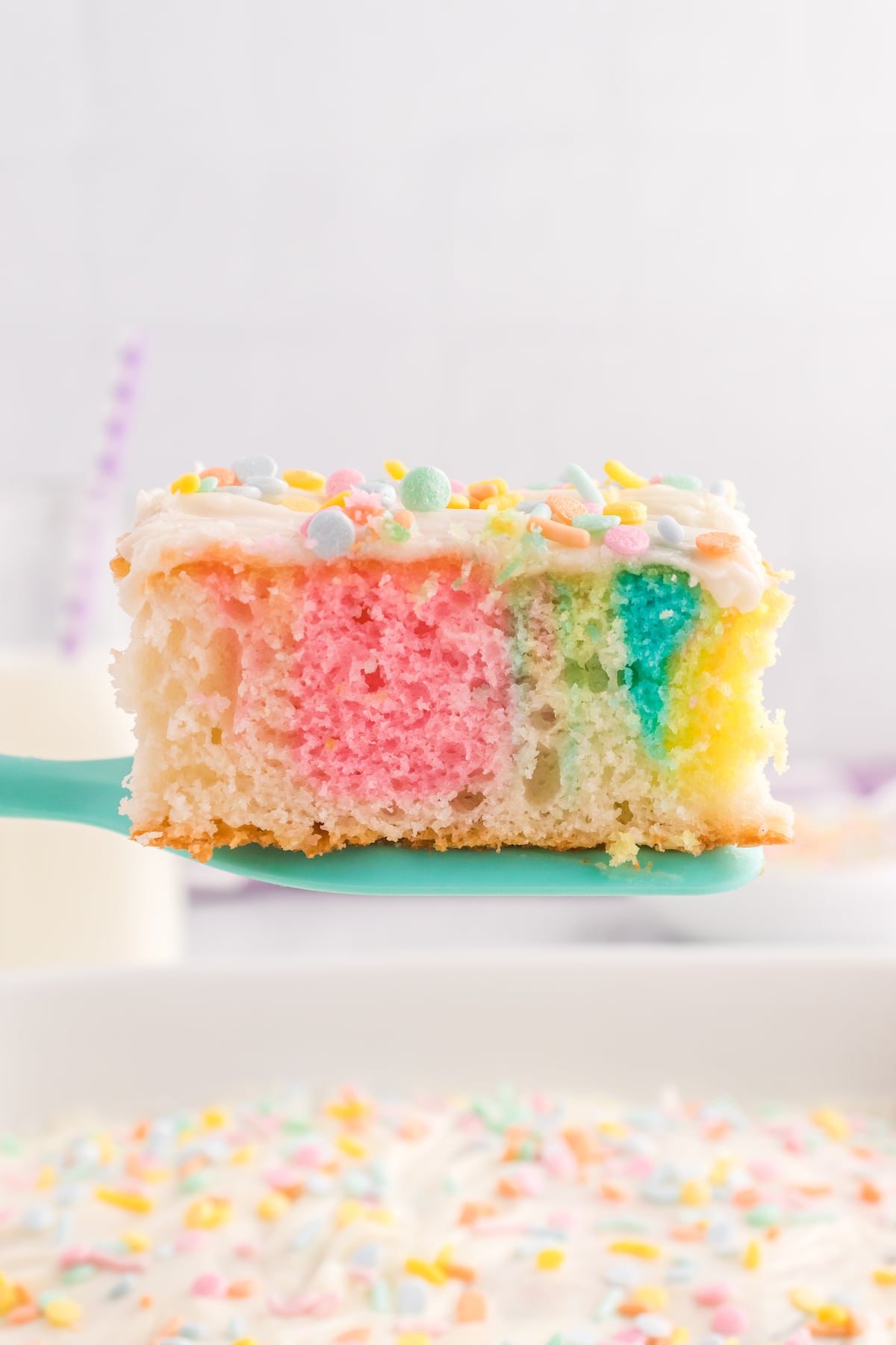 slice of tie dye easter cake on spatula