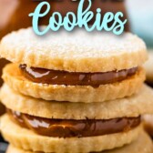 Three dulce de leche cookies stacked on top of eachother with recipe title on top of image