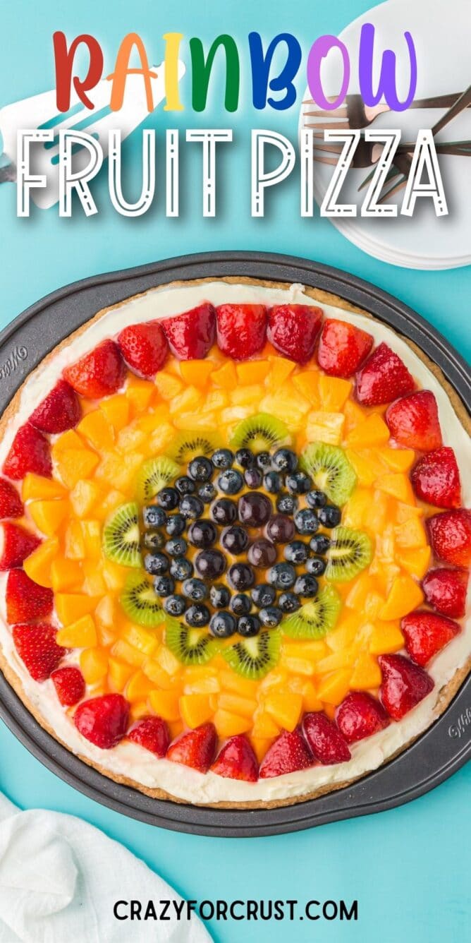 fruit pizza in pan on blue background