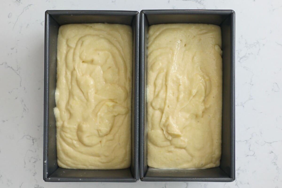 lemon cake batter in loaf pans.