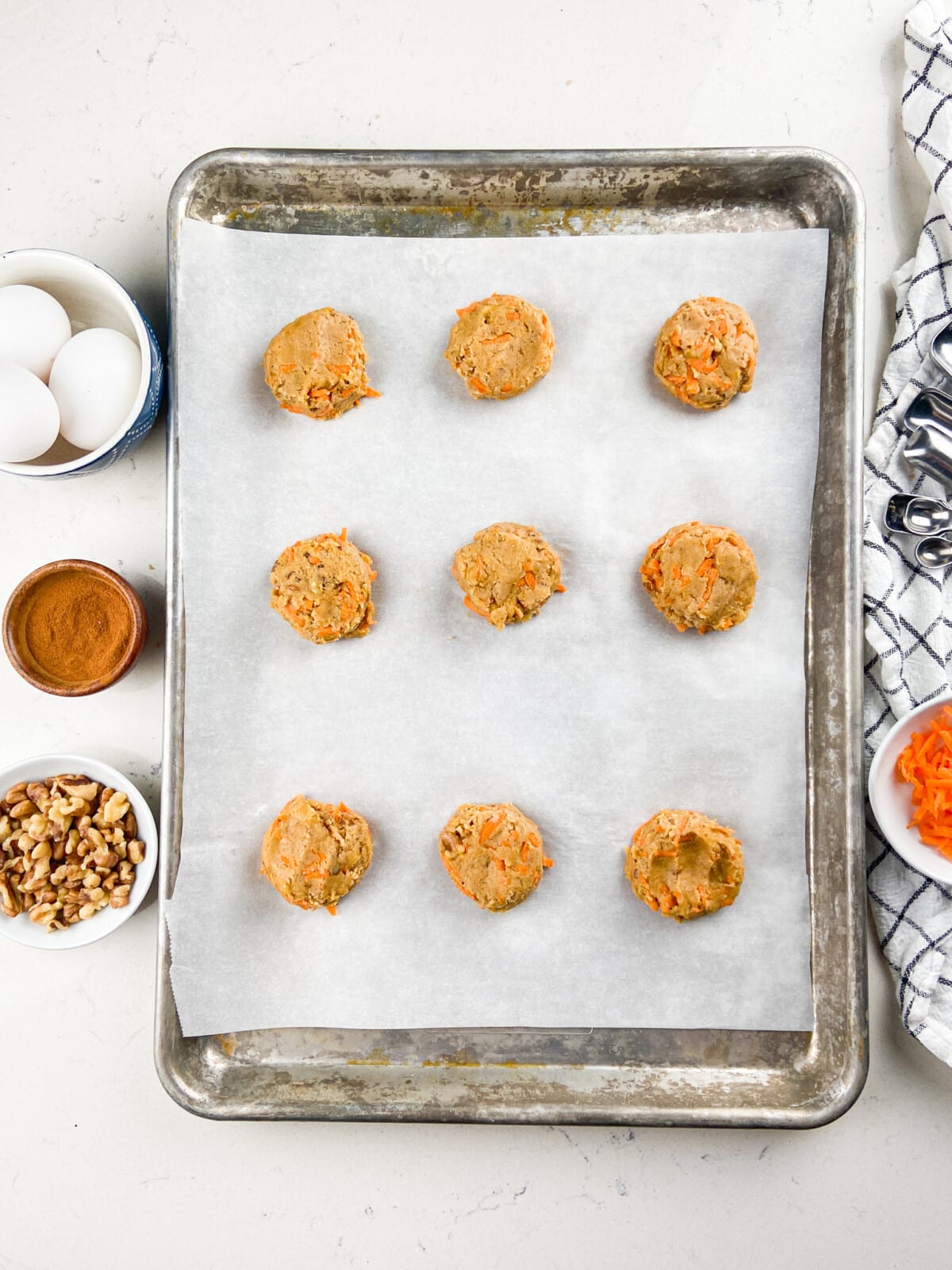 cookie dough on cookie sheet with parchment paper.