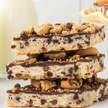 Three cookie bark pieces stacked on top of eachother with recipe title on top of image