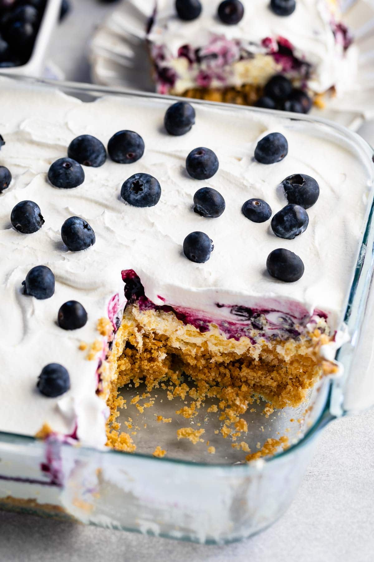 Blueberry delight lush in cake pan with corner piece missing