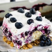 One large square slice of blueberry delight lush on a plate
