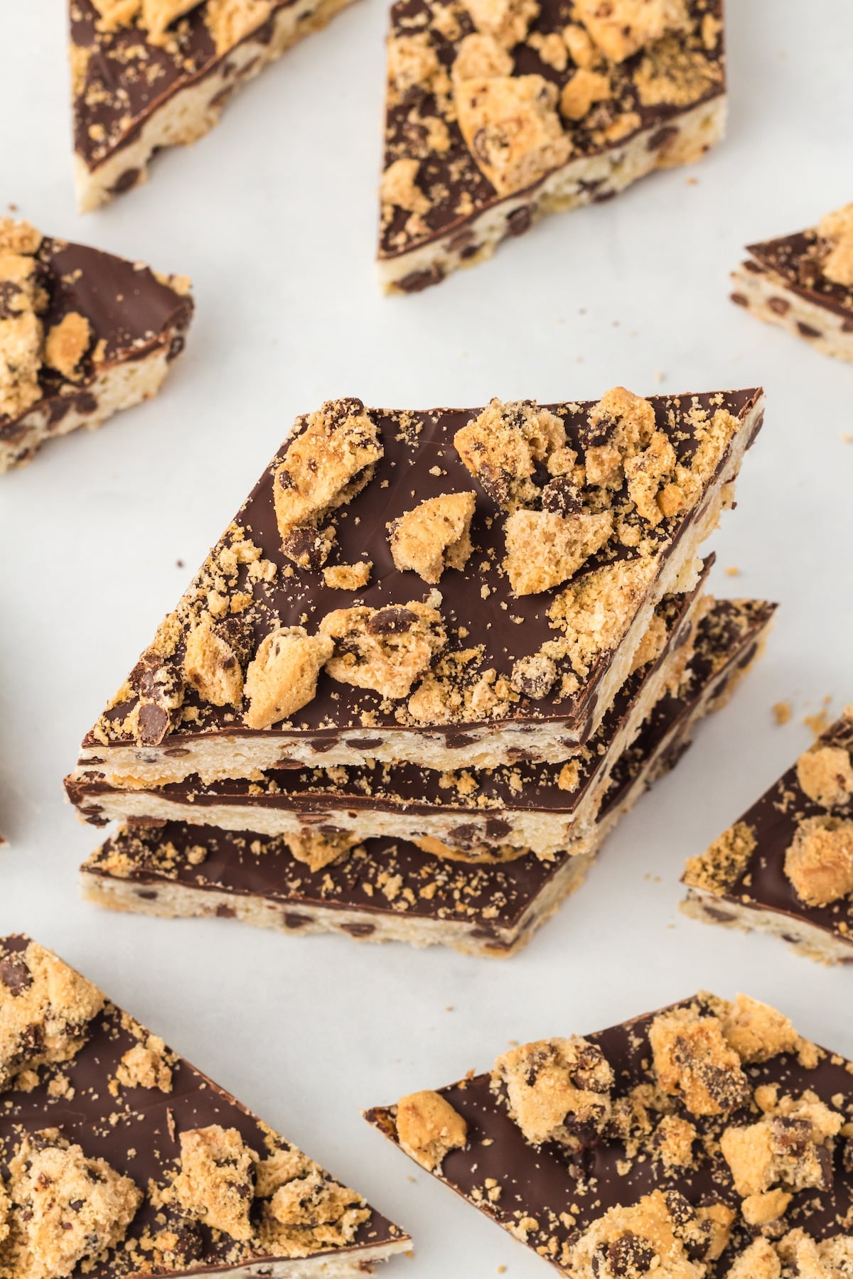 Overhead shot of cookie bark pieces with three stacked on eachother