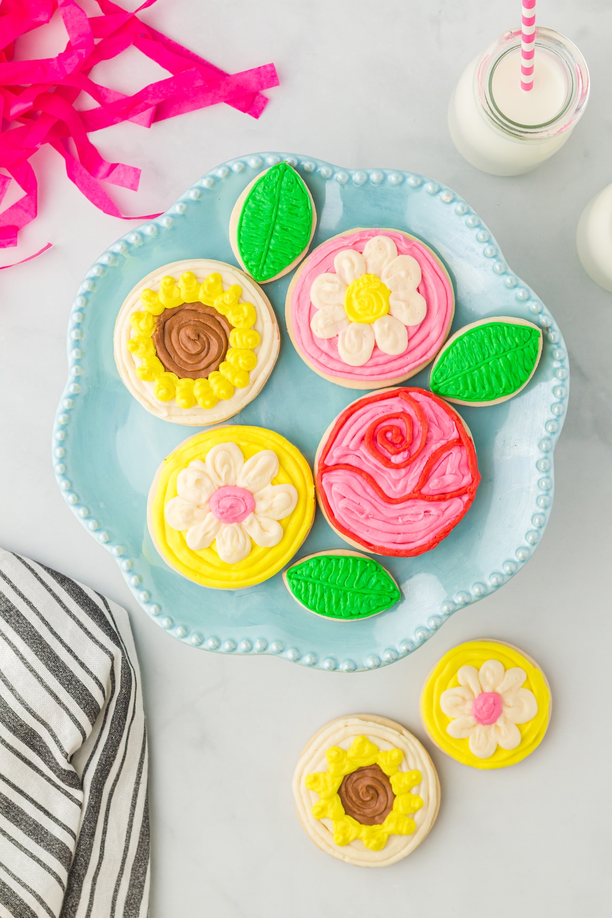 Overhead shot of all decorated sugar cookies on a plate