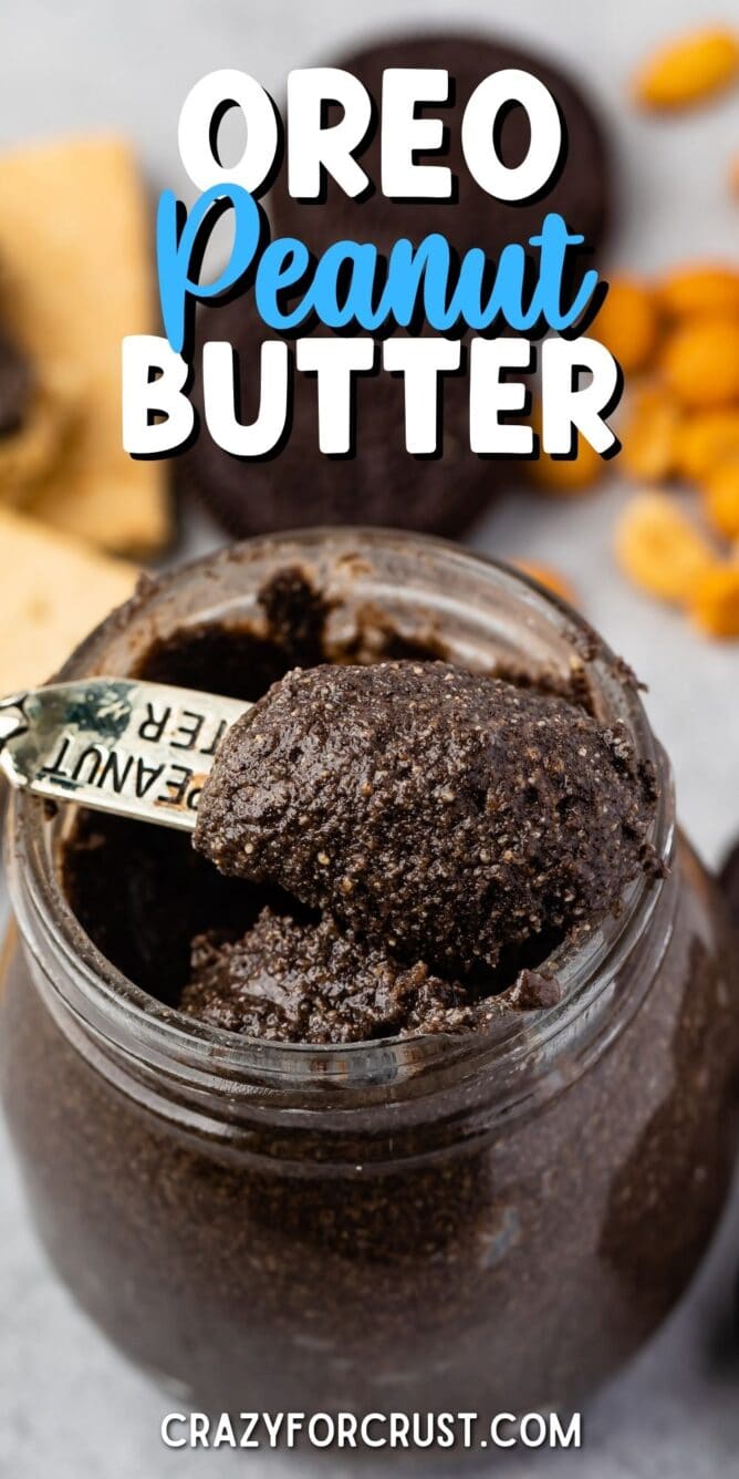 Small spoon scooping out oreo peanut butter from small mason jar with recipe title on top of image