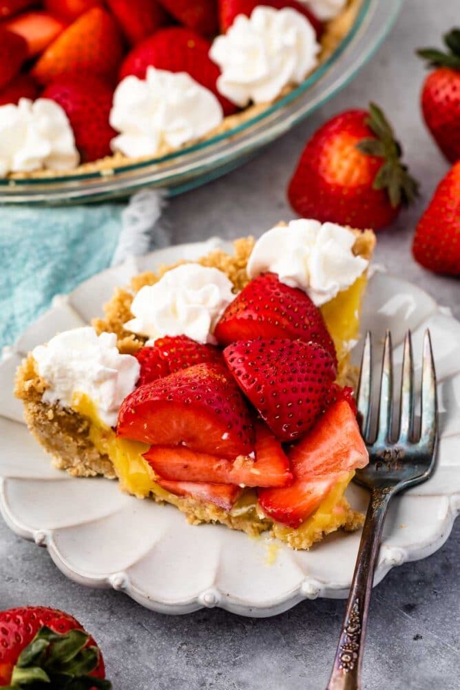 One slice of no bake strawberry shortcake pie on a plate