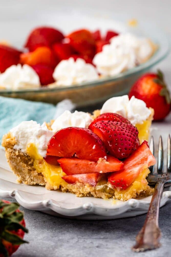 One slice of no bake strawberry shortcake pie on a plate