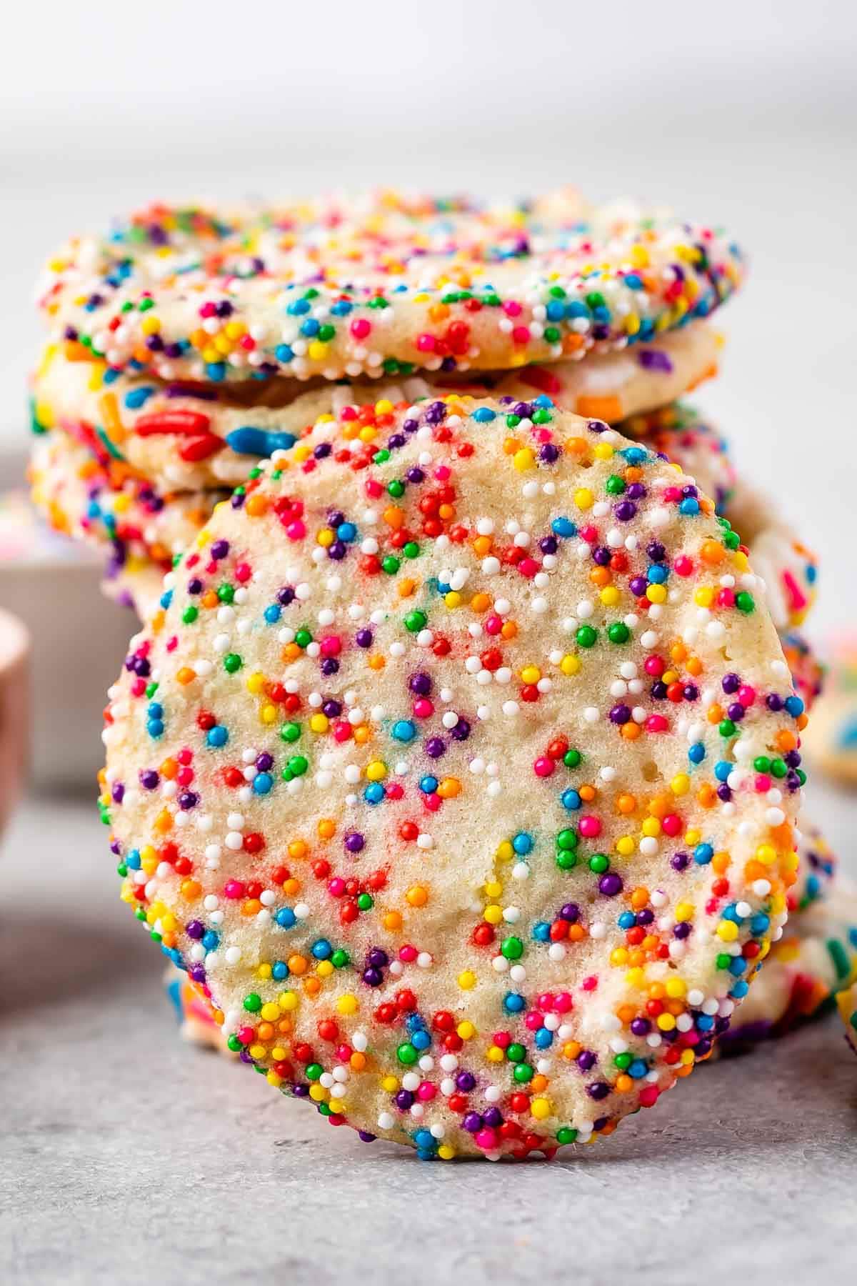 Stack of 2 ingredient sprinkle sugar cookies with one front facing the camera