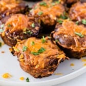 Mini BBQ meatloaves topped with cheese on a plate