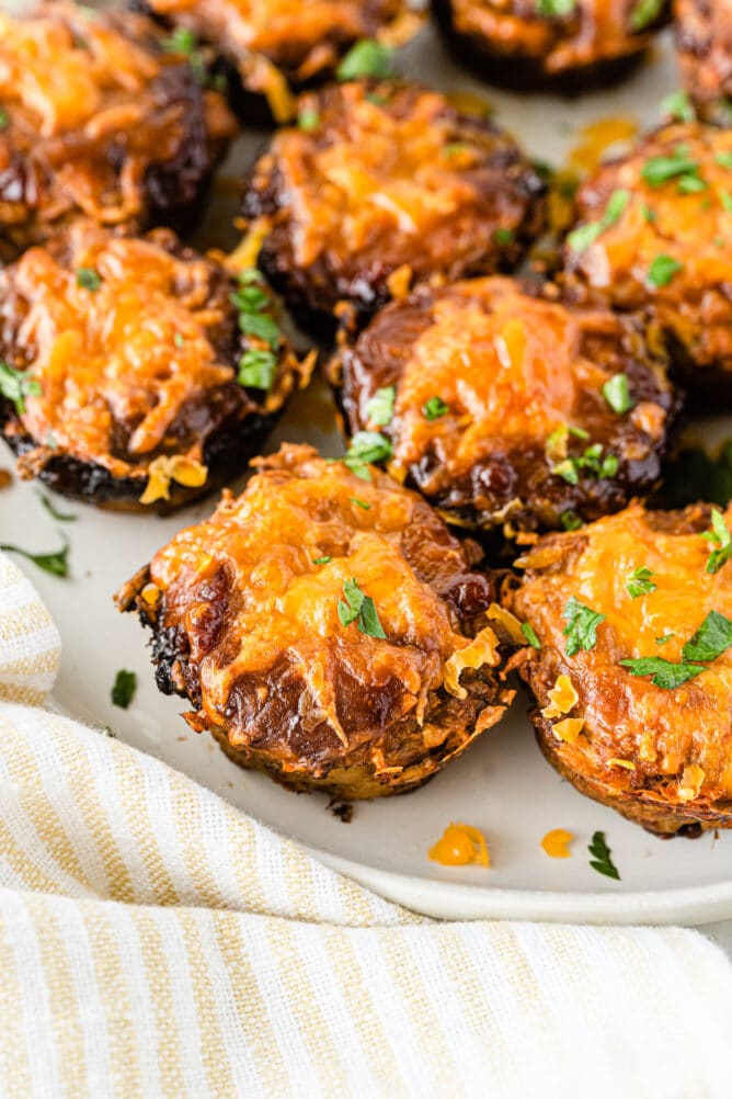 Mini BBQ meatloaves topped with cheese on a plate