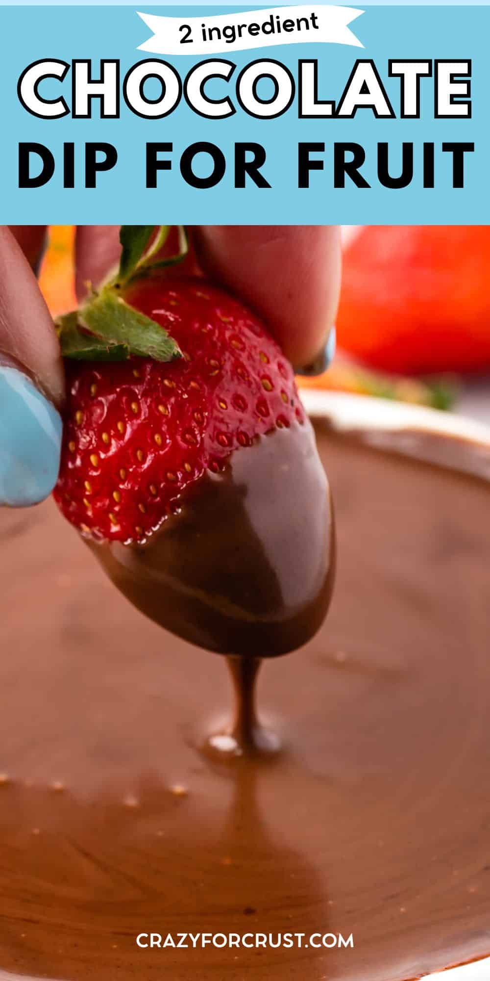 A hand with blue nail polish dips a strawberry into a bowl of rich chocolate dip. Text reads “2 ingredient chocolate dip for fruit” and “crazyforcrust.com” at the bottom.