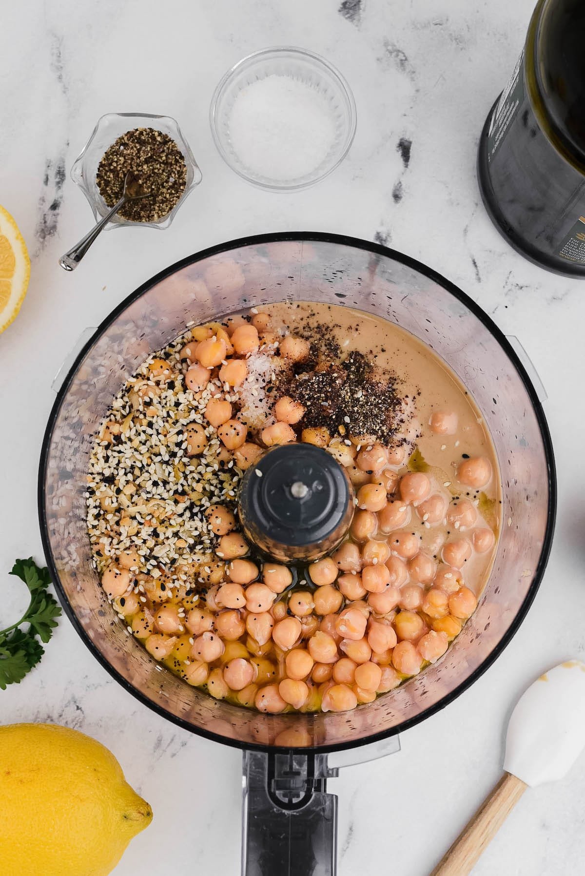 garbanzo beans in food processor with spices