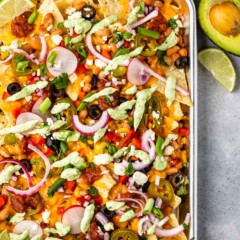 Veggie sheet pan nachos topped with all the fixings