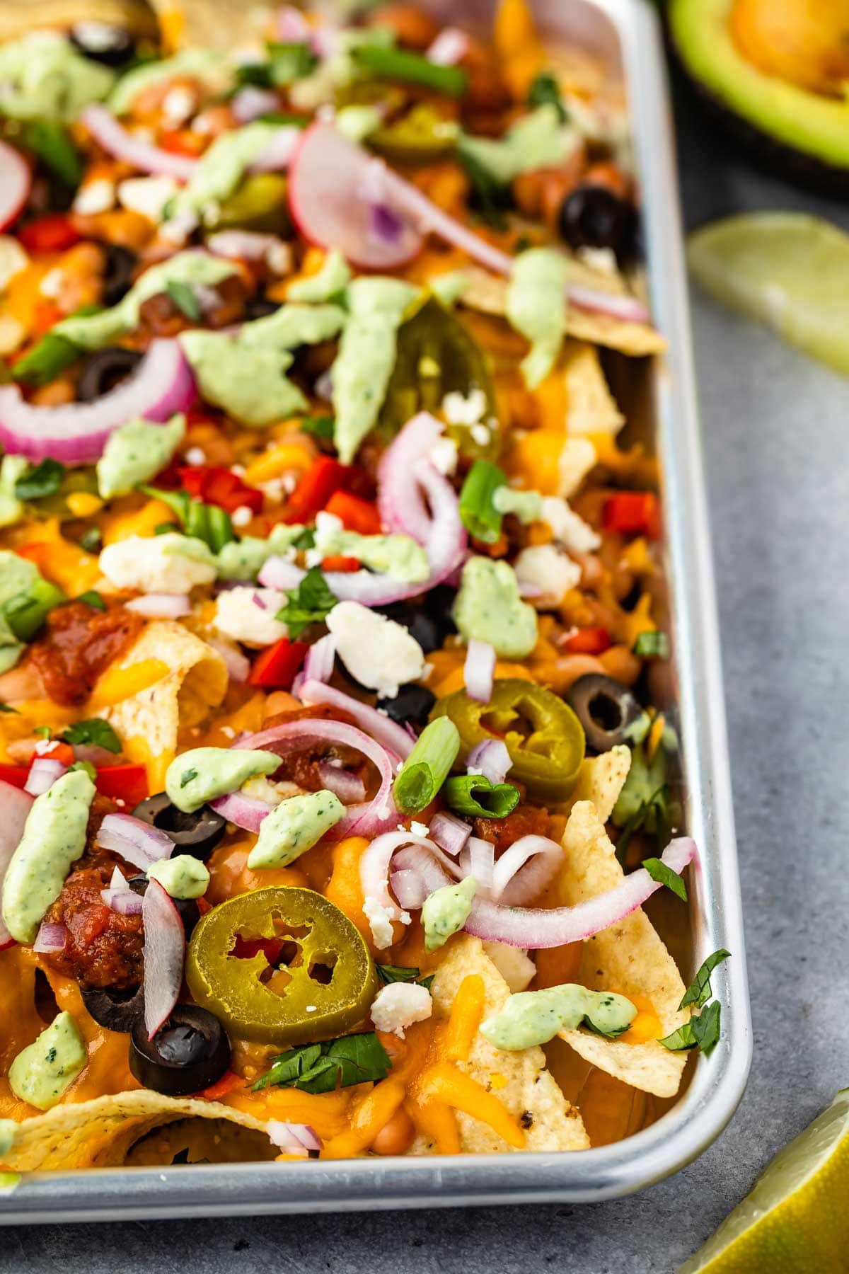 Close up shot of veggie sheet pan nachos