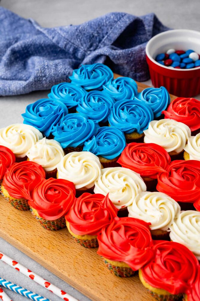 Close up shot of american flag cupcake cake on wooden cutting board