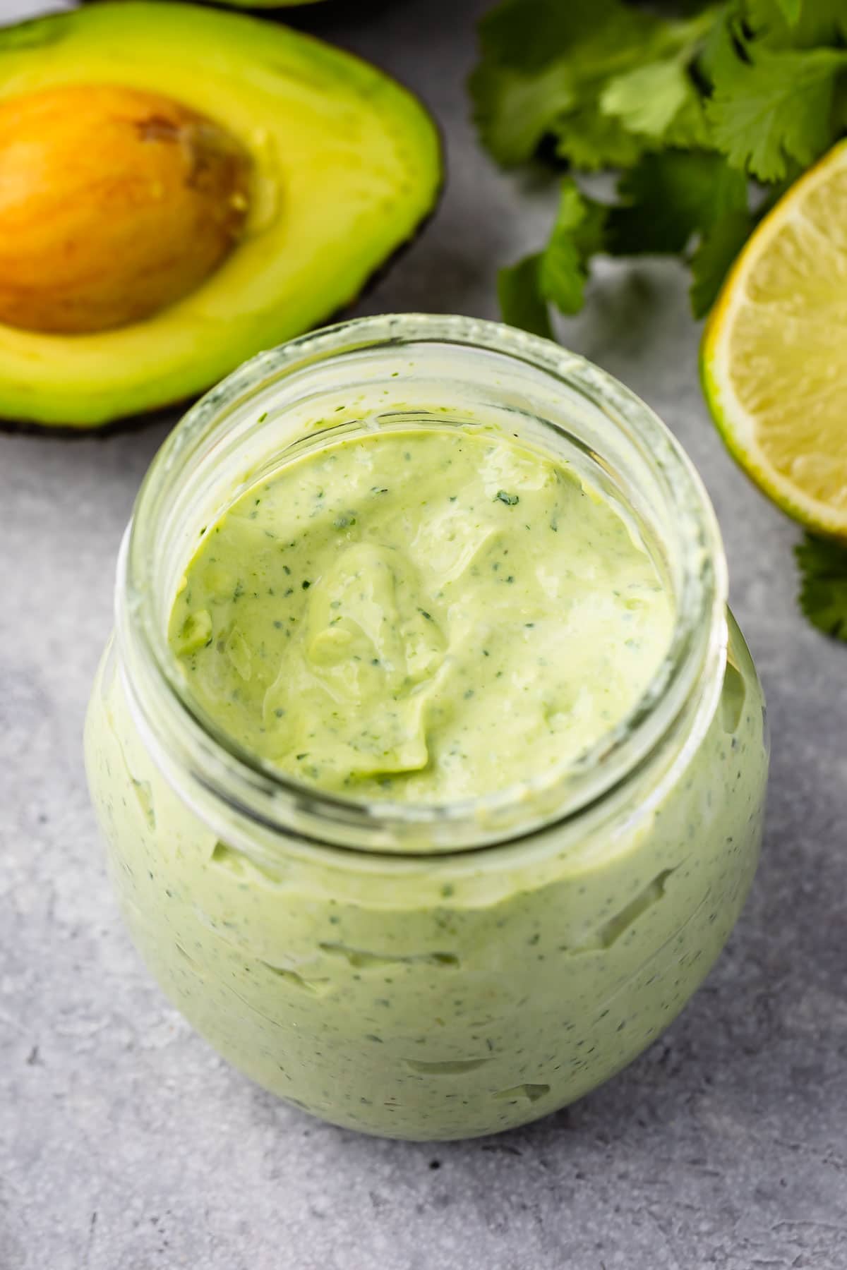 Avocado cilantro crema in a small mason jar