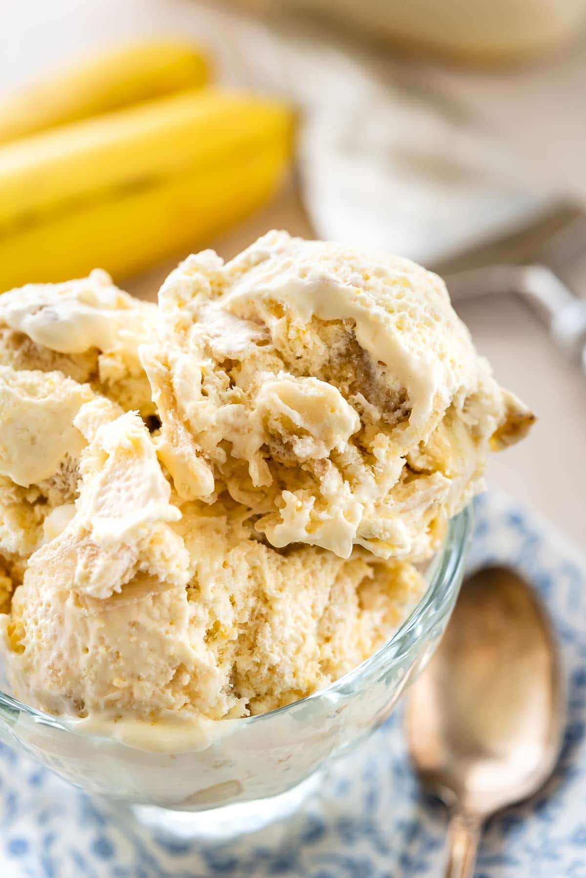 Three scoops of easy banana cream pie ice cream in a glass serving dish