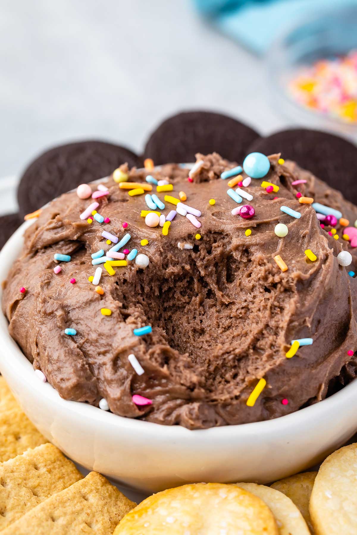 Cake batter dip in a bowl with some scooped out