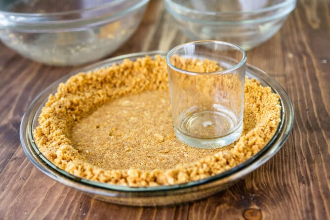 crust in plate being pressed in with glass.
