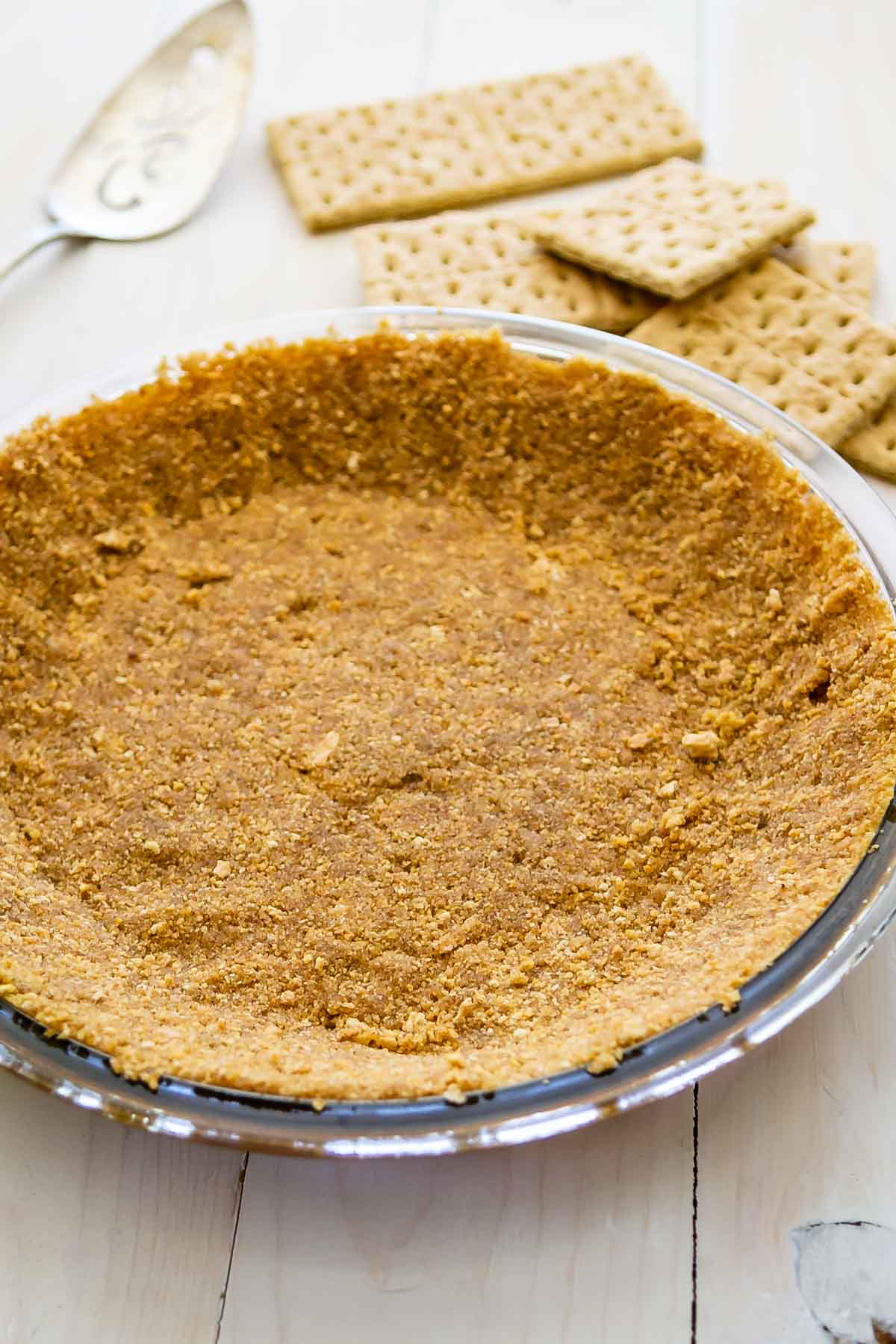 graham cracker crust in glass pie plate.