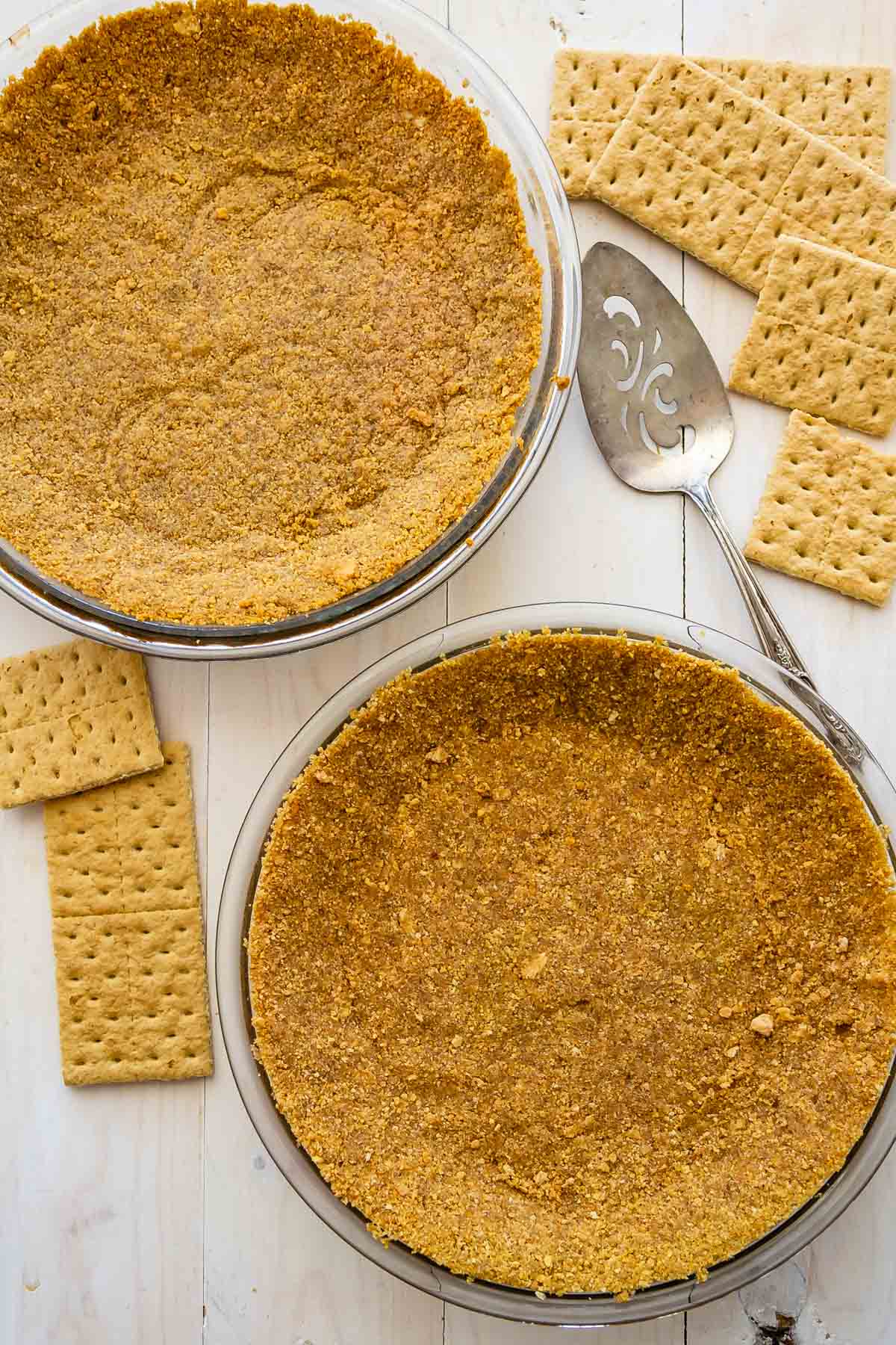 2 graham cracker crusts in glass pie plates.