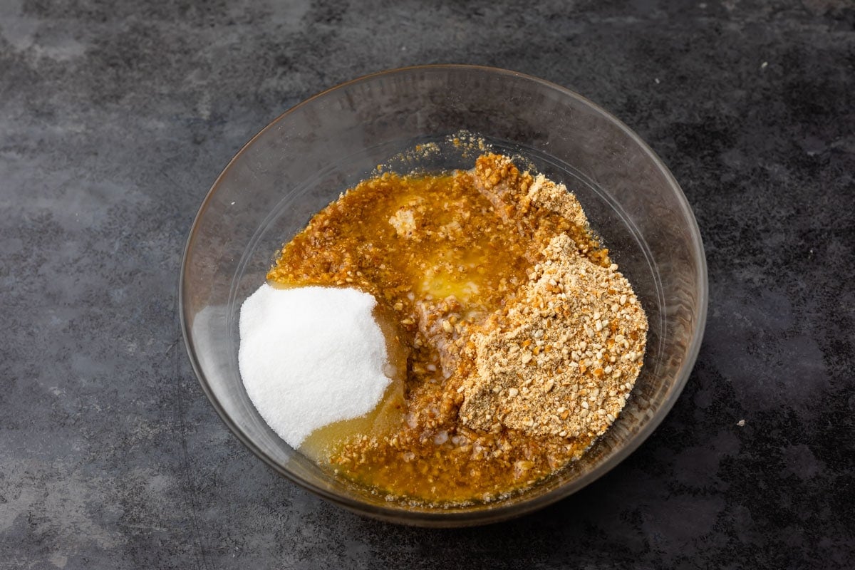 Bowl of crushed pretzels with granulated sugar and melted butter