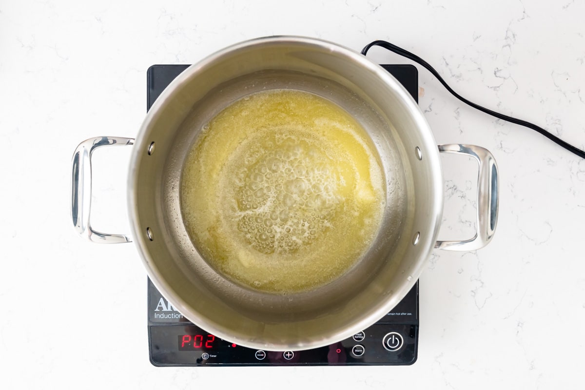 melted butter in large pot on hot plate.