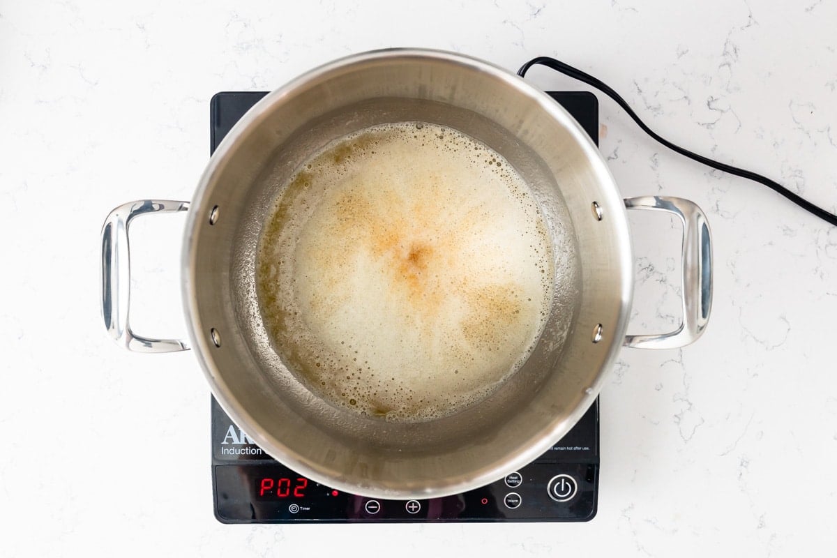 browned butter in large pot on hot plate.