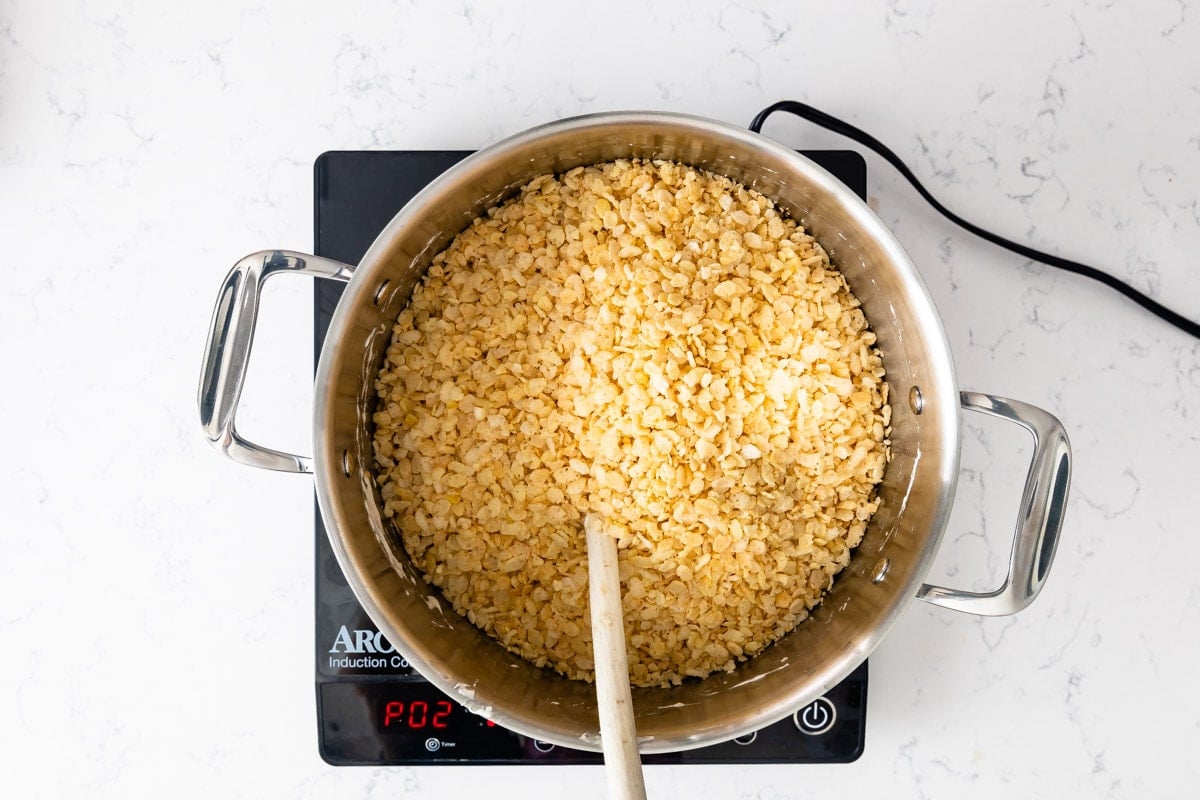 Rice Krispies in large pot on hot plate.