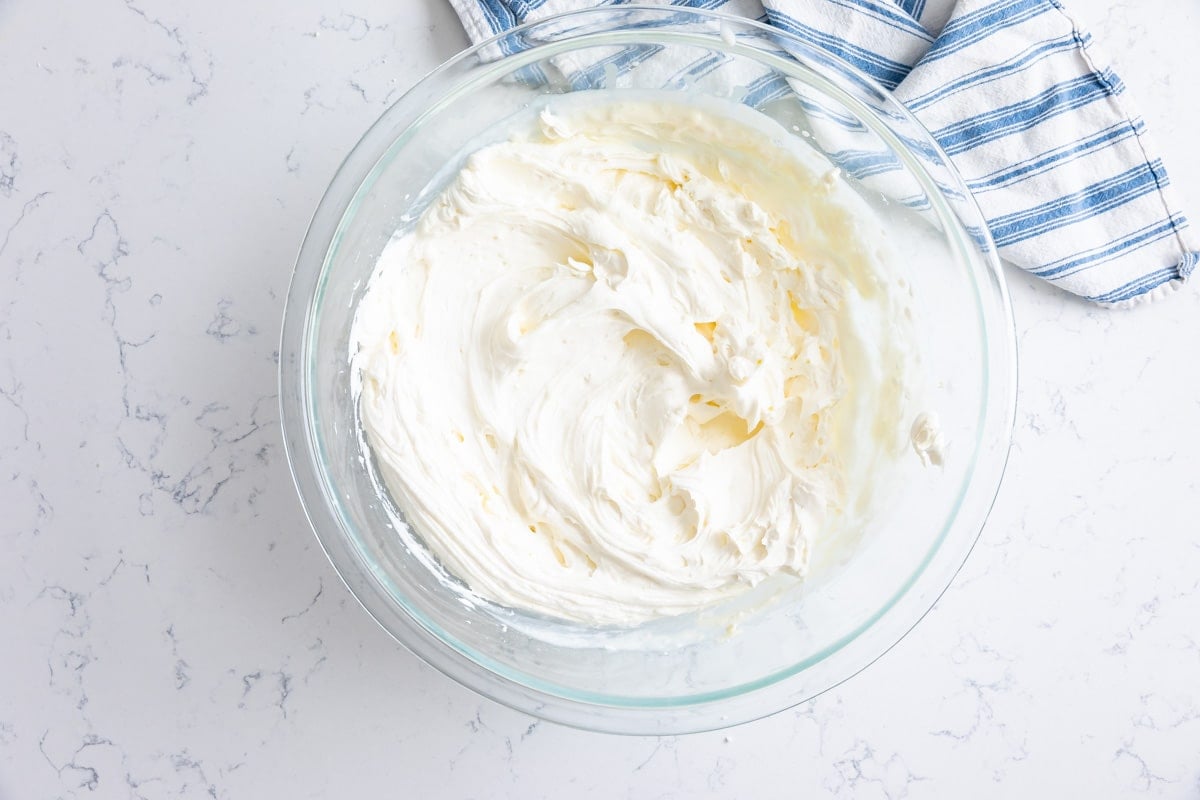 whipped cream frosting in large bowl.