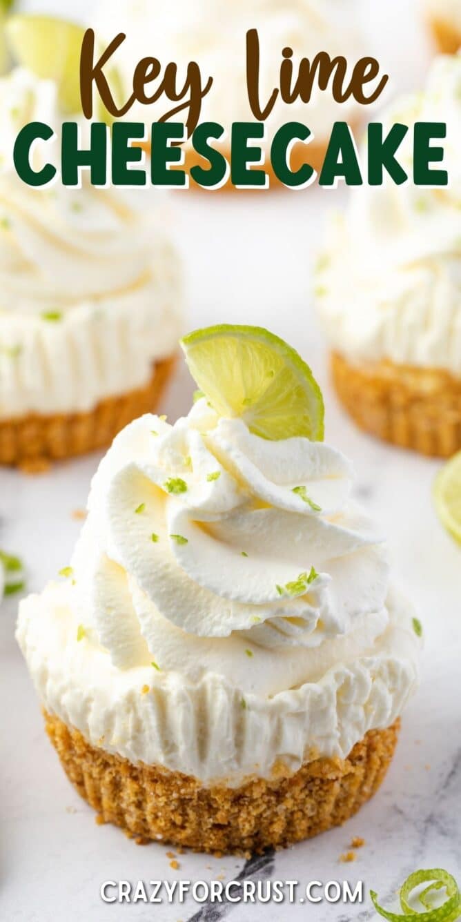 One mini no bake key lime cheesecake topped with a lime wedge and recipe title on top of image