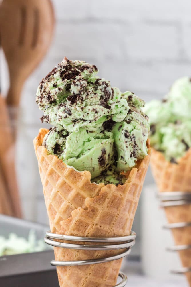 ice cream in waffle cone in cone holder.
