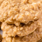 Four no bake peanut butter cookies stacked on top of eachother with recipe title on top of image