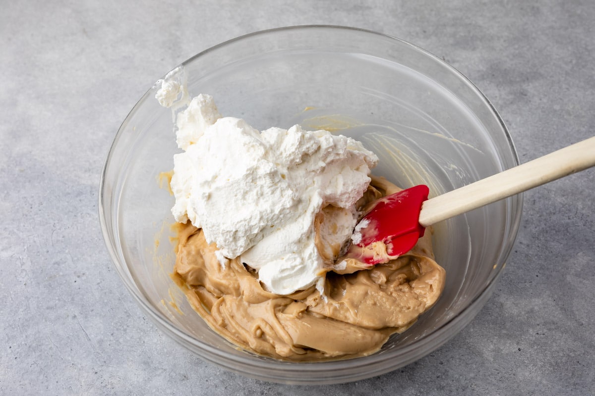 Homemade peanut butter filling being mixed with whipped cream