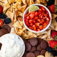 Overhead shot of sweet dip board filled with pie crust chips and dips