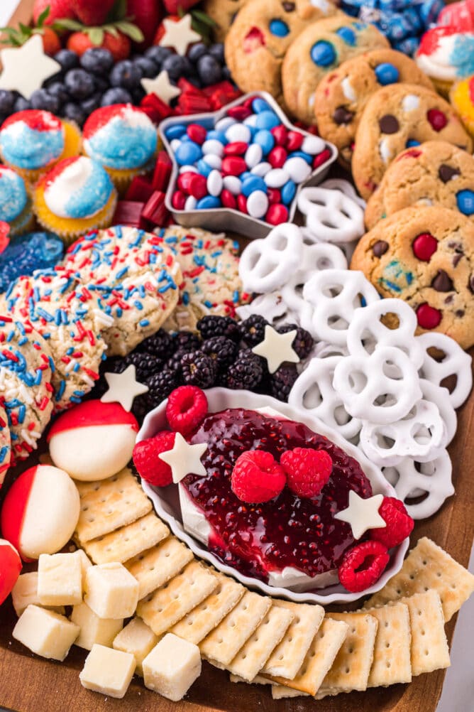 Close up shot of 4th of july dessert board filled with red, white and blue themed snacks