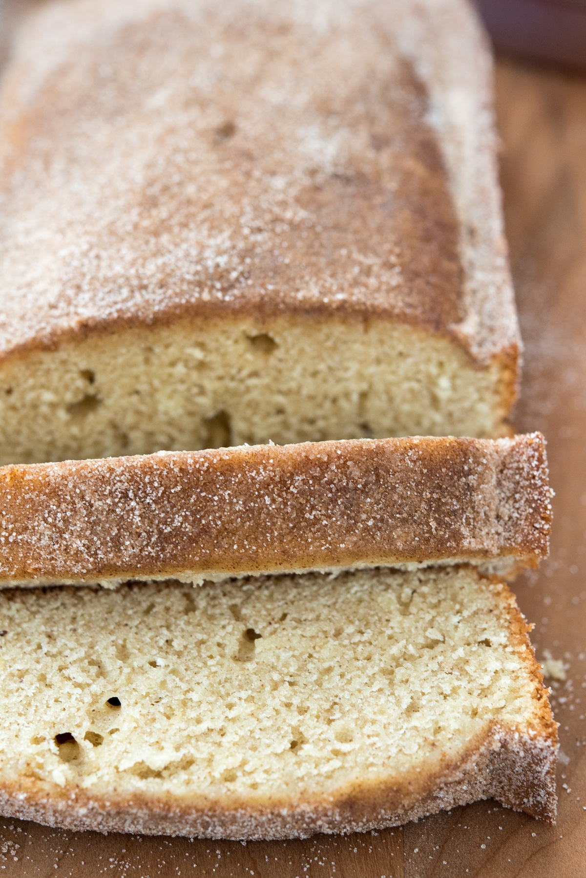 loaf of cake with two slices in front