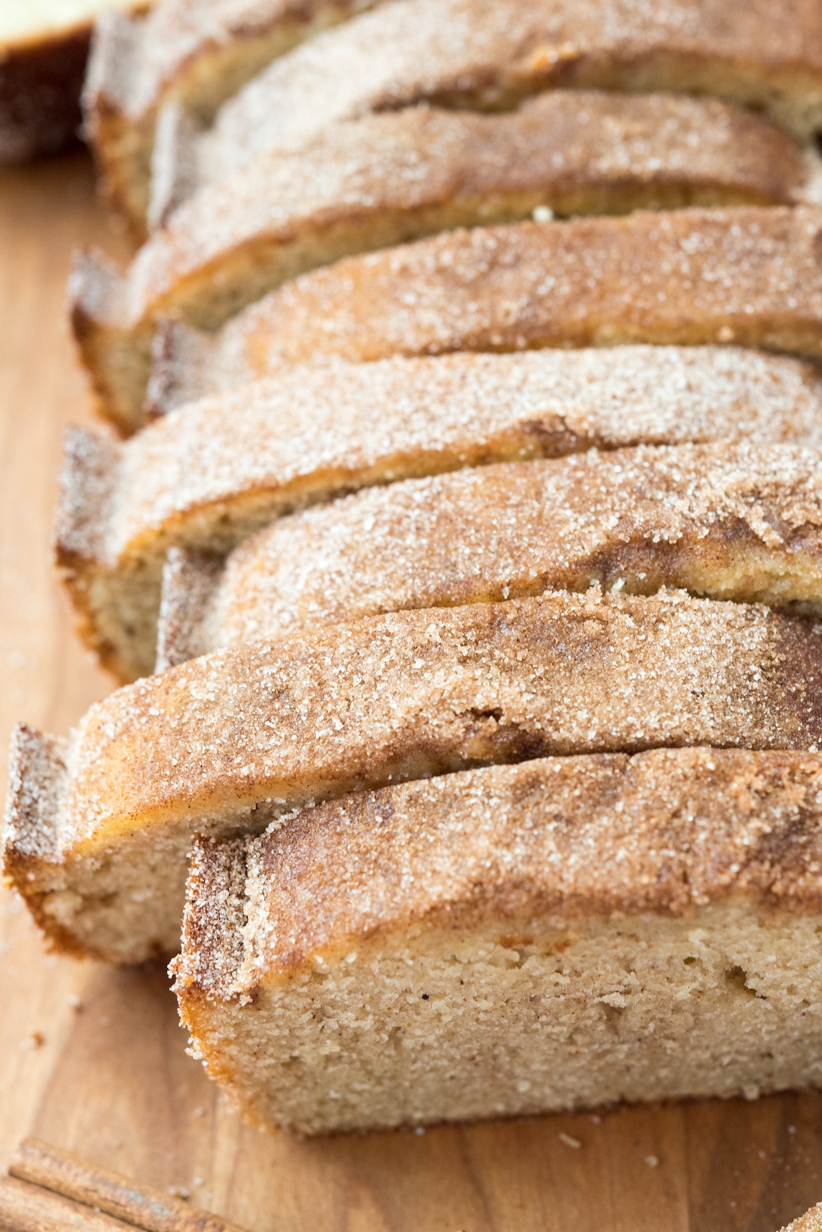 overhead shot of sliced pound cake on a cutting board