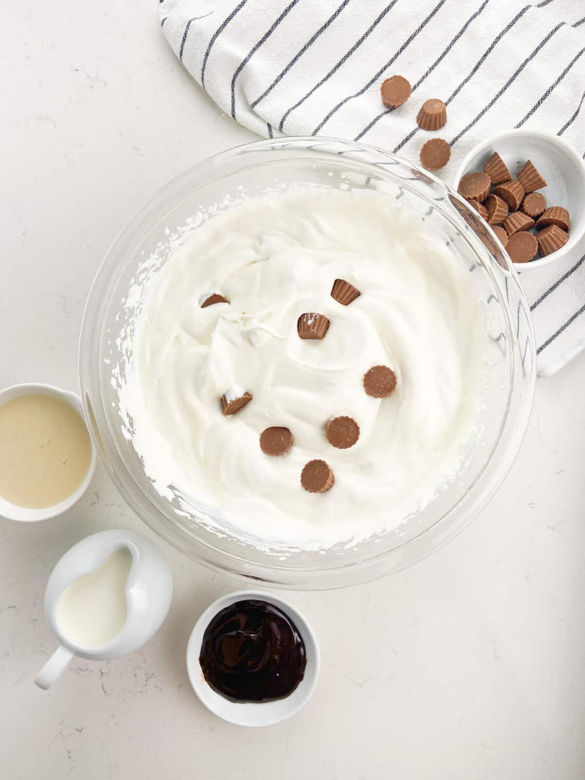 unfrozen ice cream in bowl with peanut butter cups.