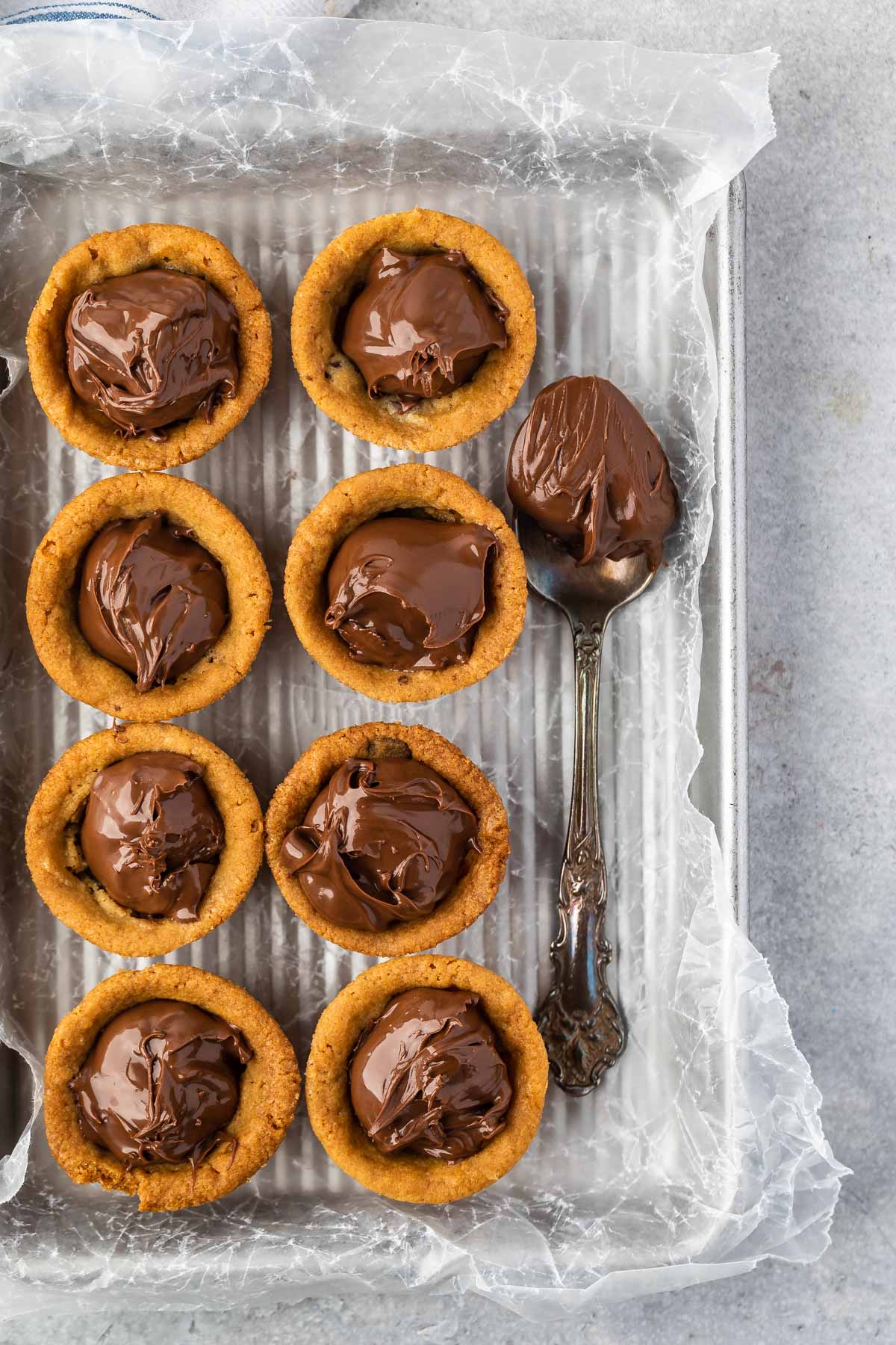 multiple nutella cups on a sheet pan