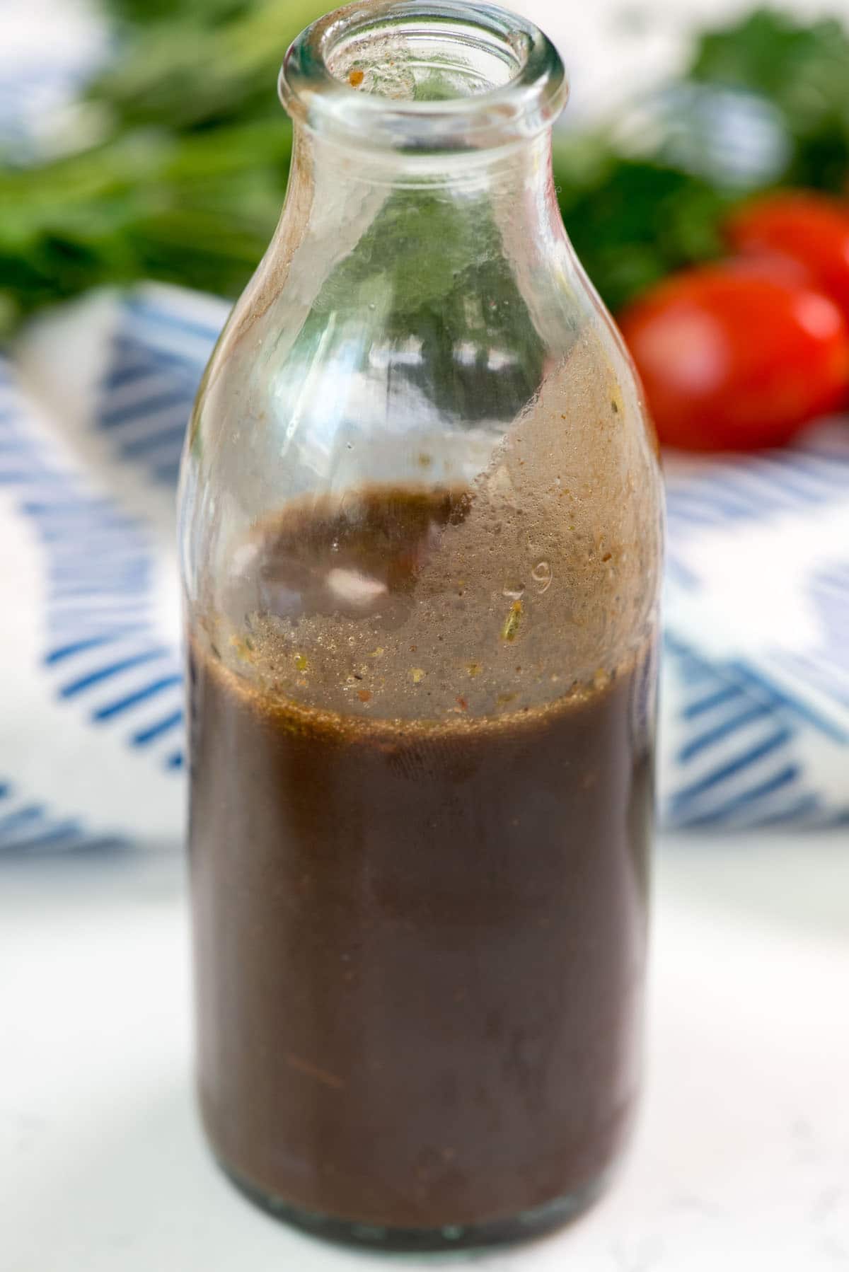 dark brown dressing in a clear jar