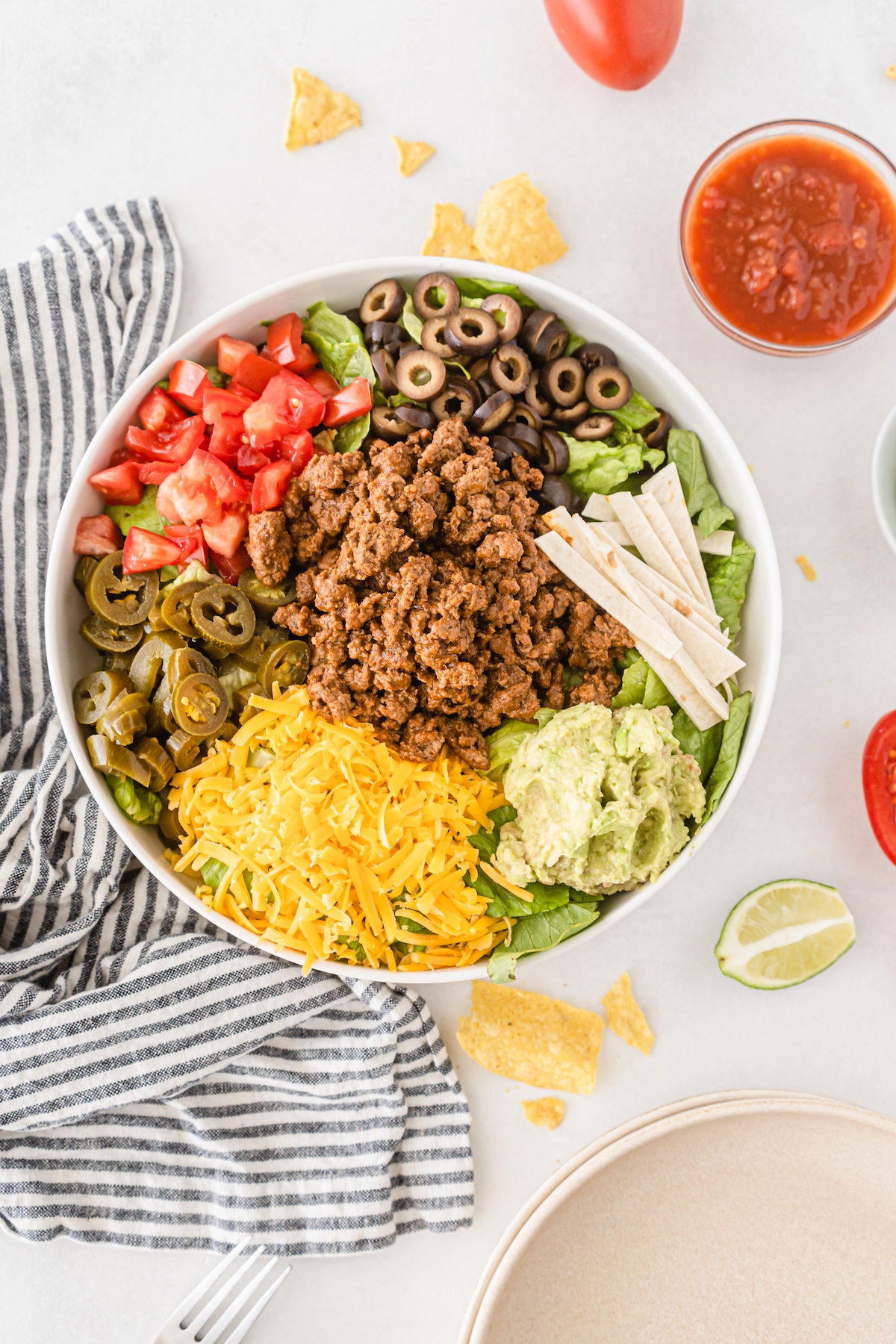 taco salad ingredients in bowl.