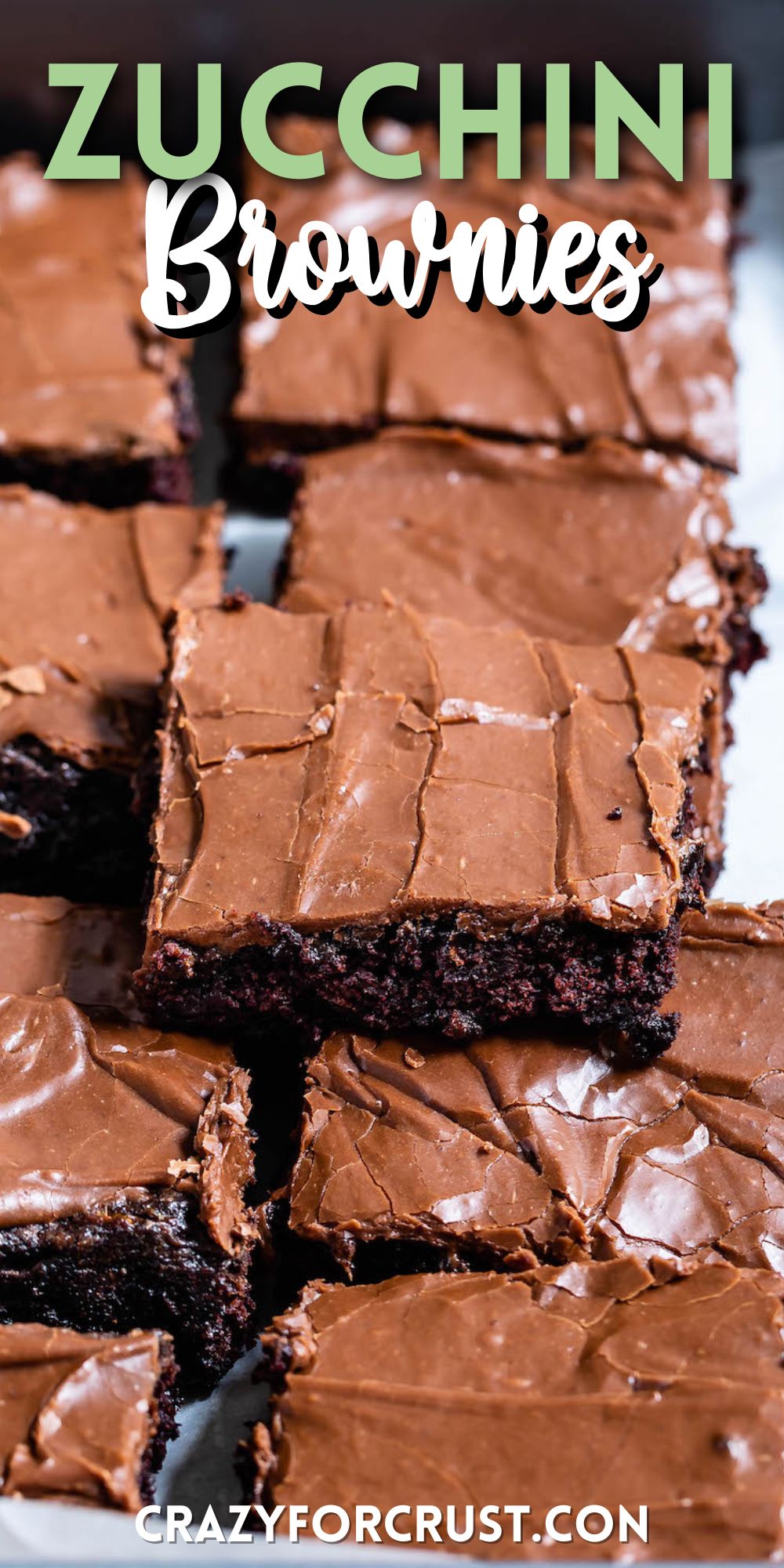 brownie with chocolate frosting sitting on other brownies with words on the photo