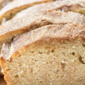 sliced pound cake on a cutting board with words on the photo