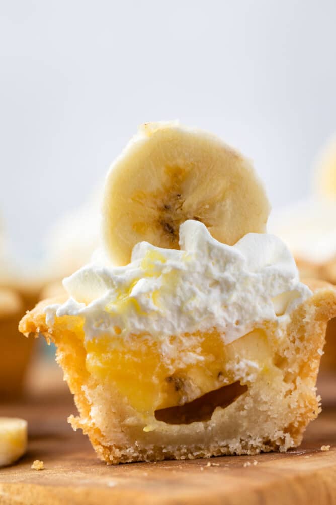 Banana cream pie cookie cup cut in half to show inside filling