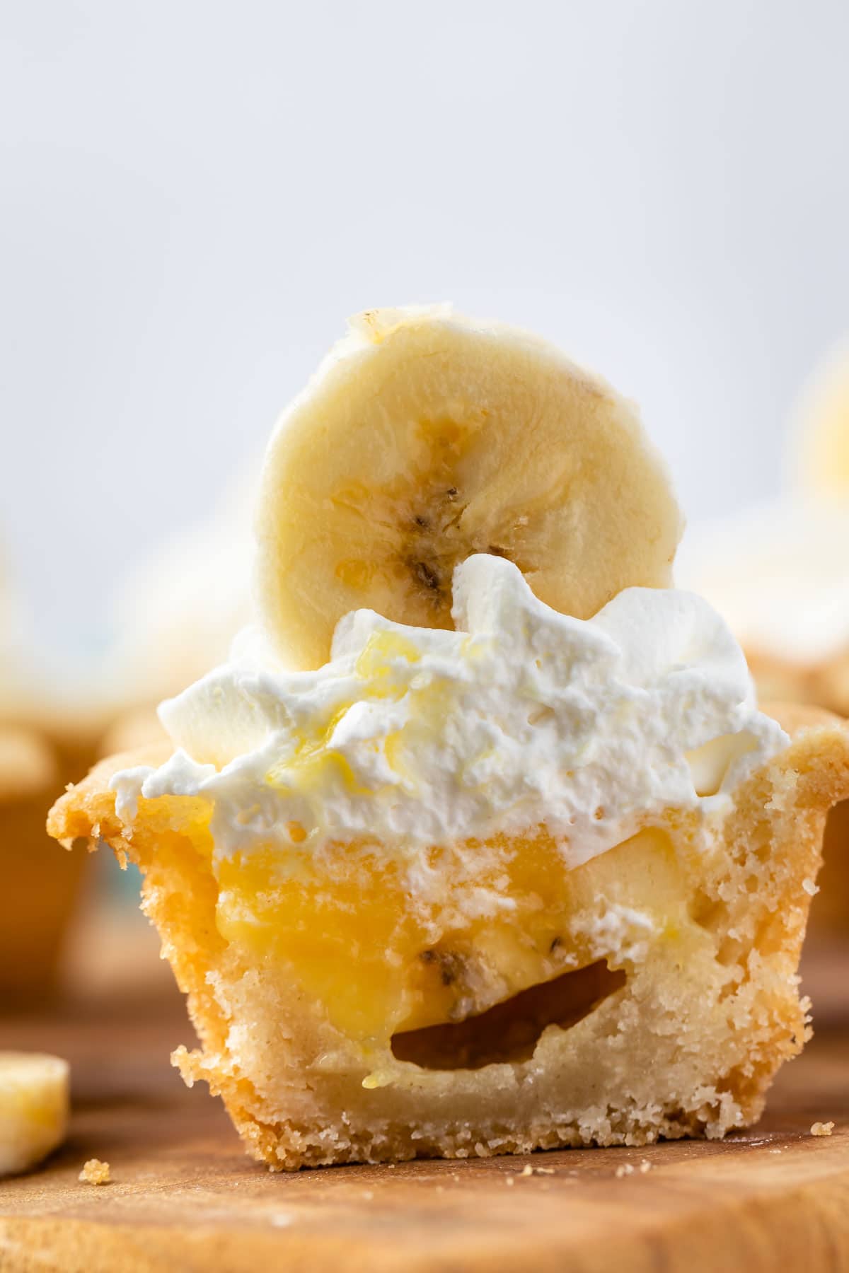 Banana cream pie cookie cup cut in half to show inside filling